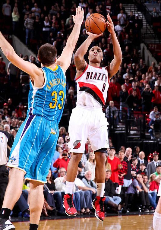 A basketball player is about to hit the ball.