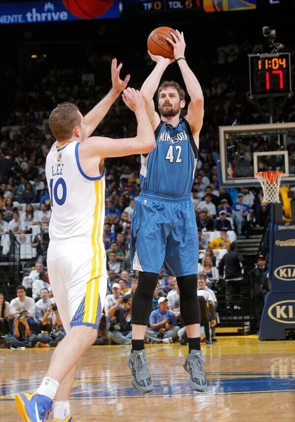 A basketball player is about to hit the ball.